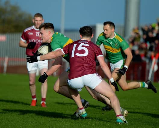 Glen’s Ethan Doherty evades a challenge from Slaughtneil’s Brian Cassidy during the 2021 Senior Football Championship Final. The Derry star is likely to be a key figure when the side meet again on Sunday. Photo: George Sweeney. DER2145GS – 009
