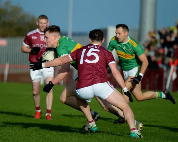 Glen’s Ethan Doherty evades a challenge from Slaughtneil’s Brian Cassidy during the 2021 Senior Football Championship Final. The Derry star is likely to be a key figure when the side meet again on Sunday. Photo: George Sweeney. DER2145GS – 009