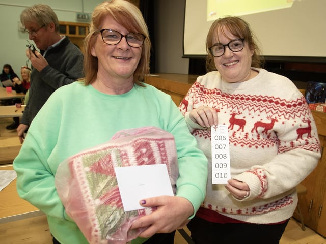 Happy punters at the Christmas Wheel of Fortune in St. Joseph's Boys' School.