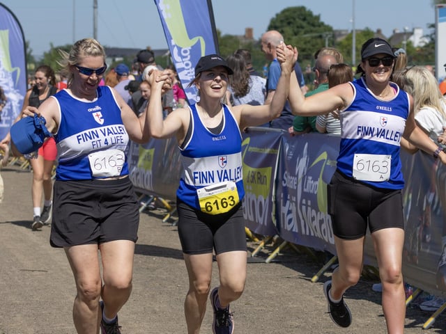 Finn Valley's Fit 4 Life relay team cross the line together.