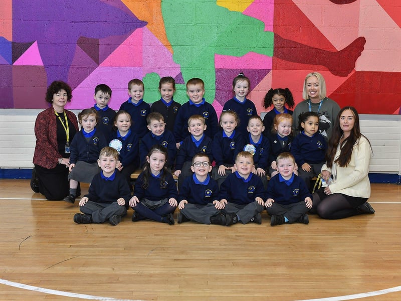 Teacher Mrs Kirk (second from right), teacher Miss Mullan (left) and Mrs McFarland classroom assistant with P1 pupils at St Therese Primary School.