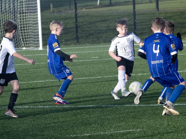A battle for possession during Saturday's 2015s Sean O'Kane Memorial Cup between Letterkenny Rovers and Trojans at St. Joseph's Boys School.