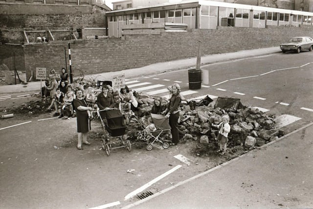 Protest staged at Barrack Street with rubble across road.