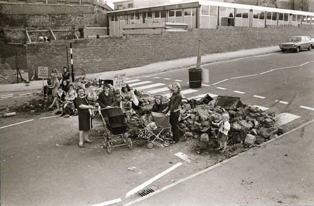 Protest staged at Barrack Street with rubble across road.