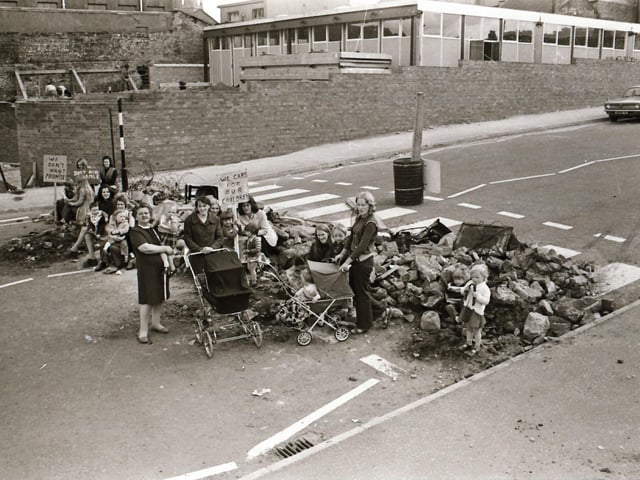 Protest staged at Barrack Street with rubble across road.