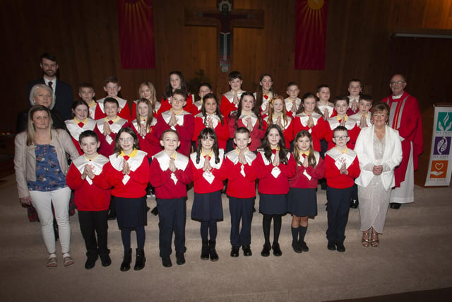 Pupils from Steelstown Primary School who received the Sacrament of Confirmation at Our Lady of Lourdes Church, Steelstown on Monday afternoon last from Monsignor Donnelly. Included in photo is Principal, Mrs Siobhan Gillen, P7 teacher, Mr. Emmett Hargan and Classroom Assistants Maria McCafferty and Terrie Stewart (Photo: Jim McCafferty Photography)