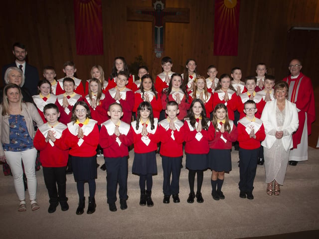 Pupils from Steelstown Primary School who received the Sacrament of Confirmation at Our Lady of Lourdes Church, Steelstown on Monday afternoon last from Monsignor Donnelly. Included in photo is Principal, Mrs Siobhan Gillen, P7 teacher, Mr. Emmett Hargan and Classroom Assistants Maria McCafferty and Terrie Stewart (Photo: Jim McCafferty Photography)