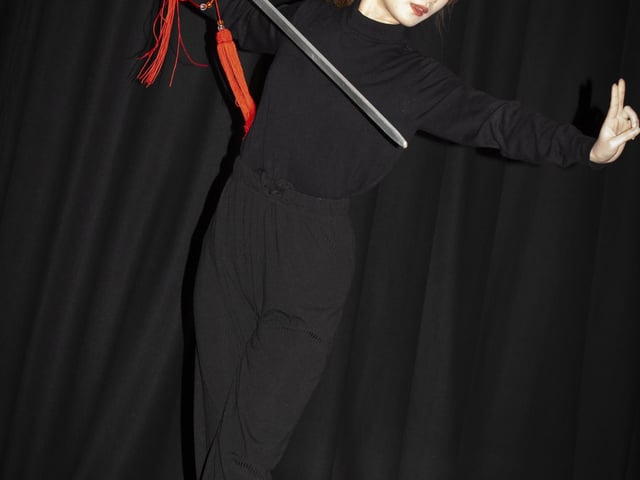 One of the traditional Chinese dancers performing a sword dance at Steelstown PS last week.