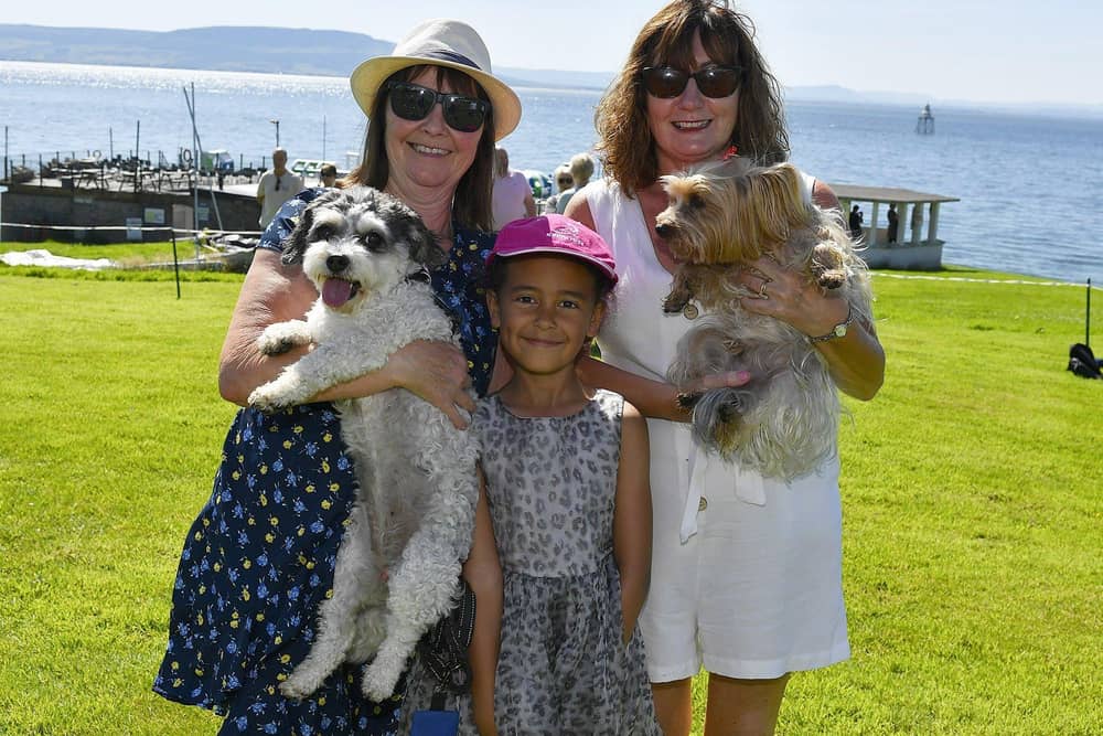 Lady and Rosie with Sheila McCormack, Alanna McCormack and Eileen Barr at the Moville Summer Festival Pet Show, held on The Green. Photo: George Sweeney