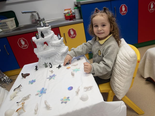 One of the Model PS nursery pupils enjoying a visit to th Primary 1 class on Monday last. : .
