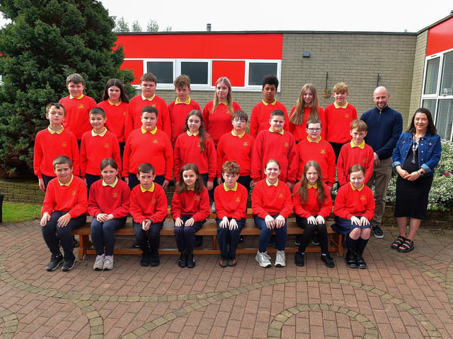 Mr Feeney’s P7 leavers class at Steelstown Primary School.  Included in the photograph is Mrs Doherty, classroom assistant. Photo: George Sweeney.  DER2320GS – 66 