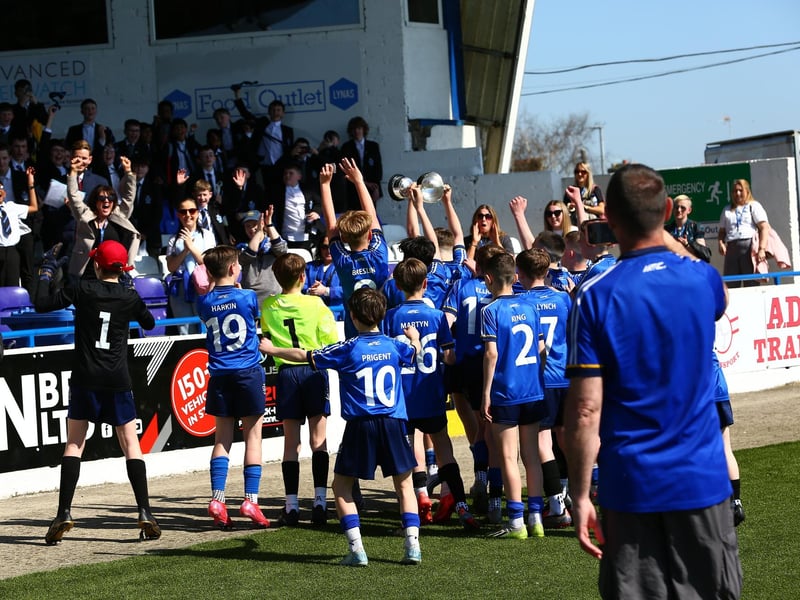The cup winners parade the trophy at the Coleraine Showgrounds.