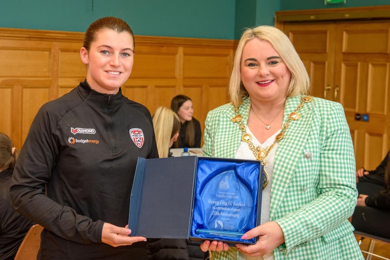 The Mayor Councillor Sandra Duffy pictured with Derry City Ladies Football team as she hosted a reception to mark their 20th anniversary. During the event the First Citizen presented a commemorative gift to captain, Shannon Dunne. The team were joined by coach Paul Dixon and Chairperson John Hegarty. Picture Martin McKeown. 05.05.23