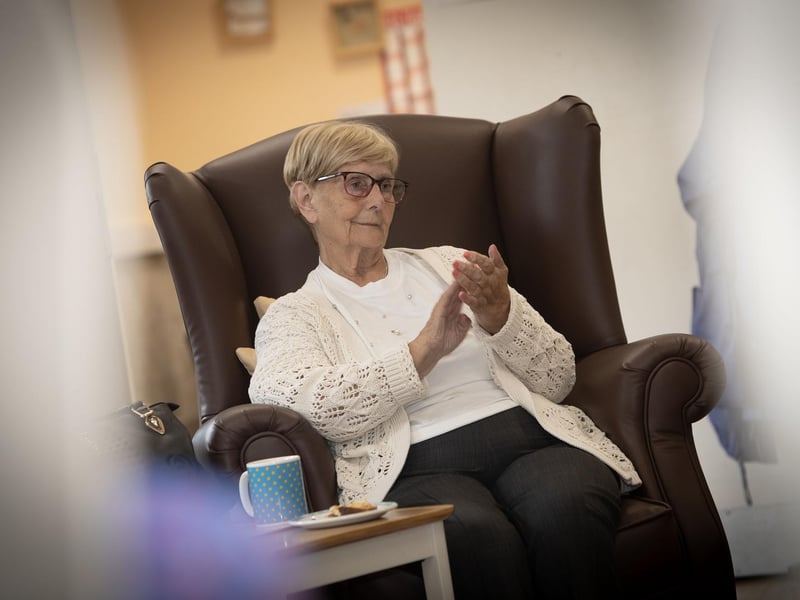 One of the residents at the Creggan Day Centre applauding the Ulster Orchestra who performed at the centre on Tuesday morning last as part of Féile 24.
