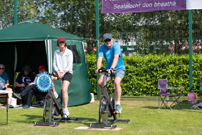 Grainne and Padraig MacGinty on the Rotary Club bikes at  Relay for Life  on Sunday. Photo Clive Wasson