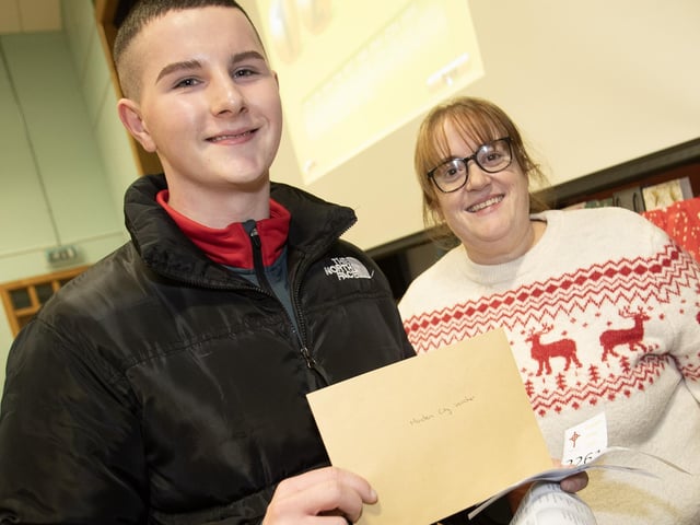 Ian Mitchell picks up his prize from Lisa Grant on Thursday night.