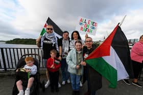People gather for a Vigil for Gaza held on the Peace Bridge on Friday Evening, organised by the Derry Irish Palestinian Solidarity Campaign. Photo: George Sweeney