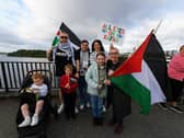 People gather for a Vigil for Gaza held on the Peace Bridge on Friday Evening, organised by the Derry Irish Palestinian Solidarity Campaign. Photo: George Sweeney