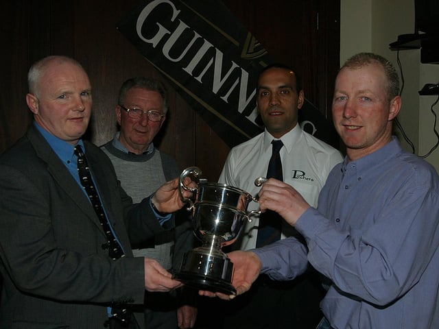 Handing over the trophy back in 2003.