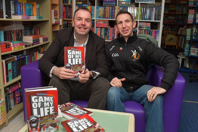 Journalist Michael McMullan pictured with Piaras O Donghaile, Doire Colmcille GAC, at the launch of his new Derry GAA Book ‘Game of my Life’, in the Little Acorns Book Store, on Saturday morning. Photo: George Sweeney