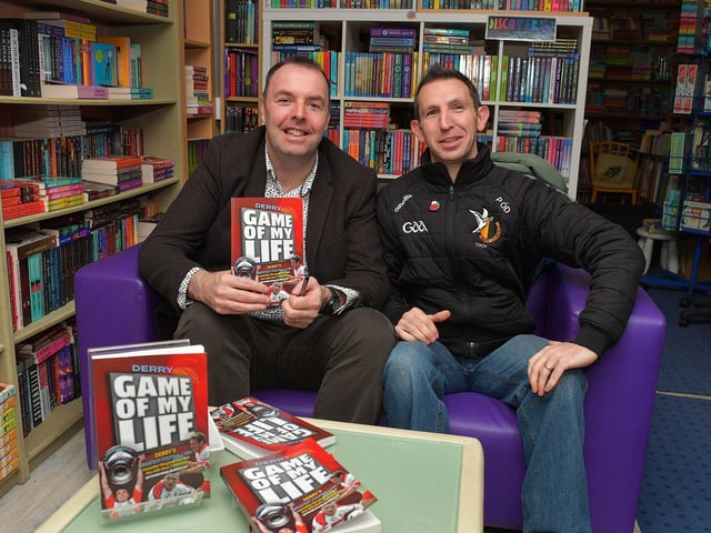 Journalist Michael McMullan pictured with Piaras O Donghaile, Doire Colmcille GAC, at the launch of his new Derry GAA Book ‘Game of my Life’, in the Little Acorns Book Store, on Saturday morning. Photo: George Sweeney