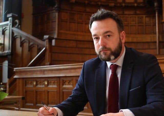 Colum Eastwood MP.