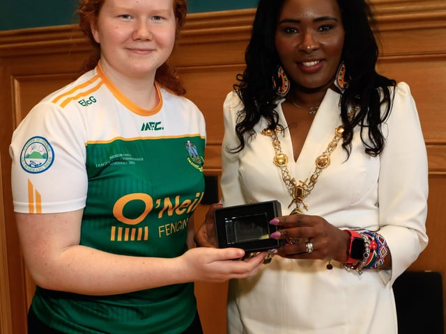 Mayor Lilian Seenoi Barr makes a presentation to Aideen McGill at a reception for Craigbane GAC and Clann na nGael GAC held in the Guildhall. (Photo - Tom Heaney, nwpresspics)