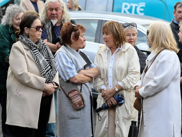 Mourners at the funeral of journalist and activist Nell McCafferty at the Long Tower Church on Friday afternoon.  Photo: George Sweeney