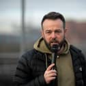 Colum Eastwood MP speaking at the march and rally on Saturday afternoon, calling for a ceasefire in Gaza. Photo: George Sweeney