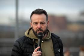 Colum Eastwood MP speaking at the march and rally on Saturday afternoon, calling for a ceasefire in Gaza. Photo: George Sweeney