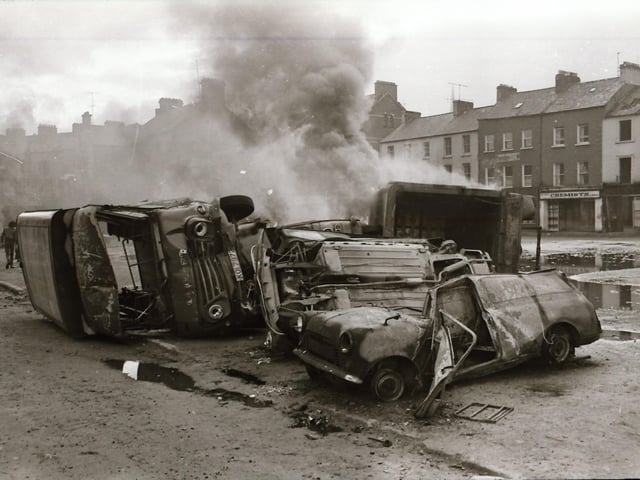 The aftermath of rioting in Derry during which the Post Office sorting office was burnt down.