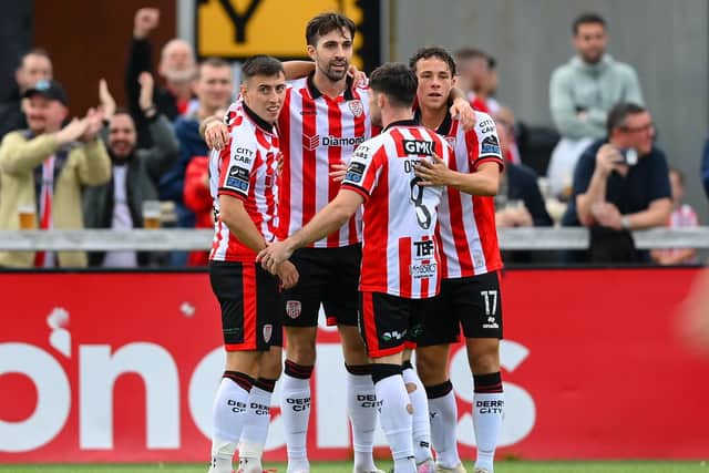 Ellis Chapman of Derry City, second from left, celebrates with teammates, from left, Darragh Burns, Adam O'Reilly and Nick Twisk after he scores his side's first goal against Shamrock Rovers.