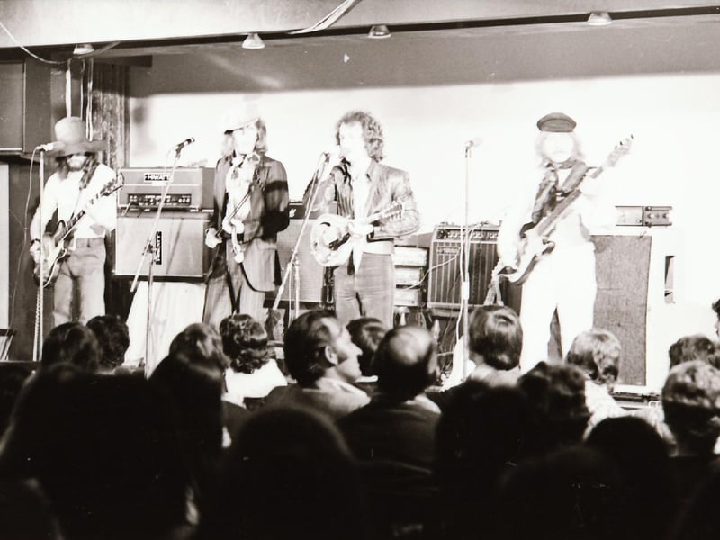 A band performing on stage back in 1975.
