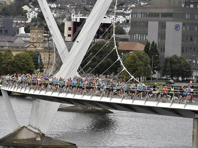Competitors in the Waterside Half Marathon make their way over the Peace Bridge. Photo: George Sweeney