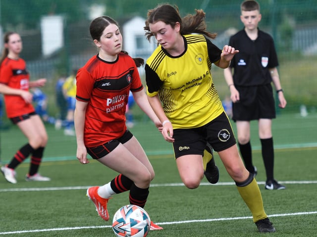 A Dunree forward spins past an Irvinestown Wanderers defender during their girls under-13's match at the Waterside Shared Village.