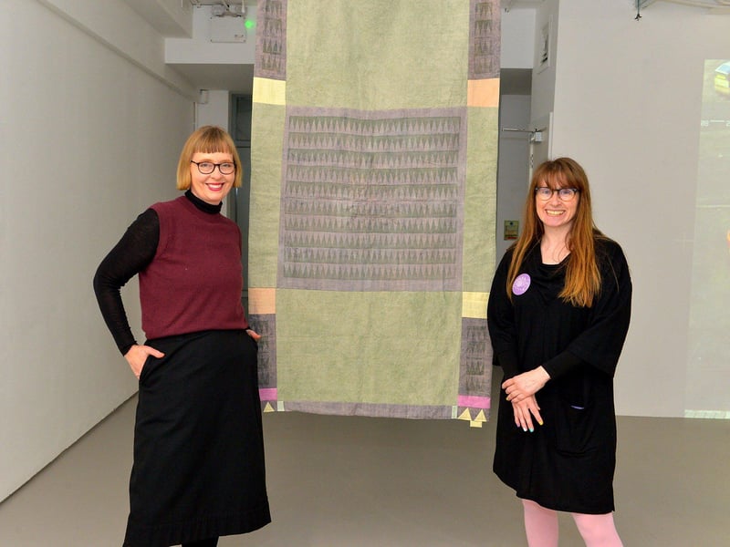 Artist Joy Gerrard, left, and Catherine Hemelryk, Director of the CCA, pictured beside Sarah Diver Lang’s Energy Quilt, selected work from artists for the Centre for Contemporary Art’s ‘Urgencies’ Exhibition which runs until 18th March next. Photo: George Sweeney. DER2304GS – 25