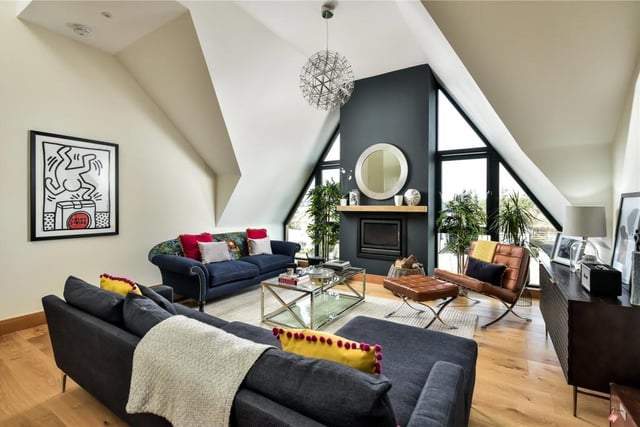 The first floor sitting room is a stunning and naturally bright living space with views over the garden and beyond and has vaulted ceilings, a log burning stove and large windows.