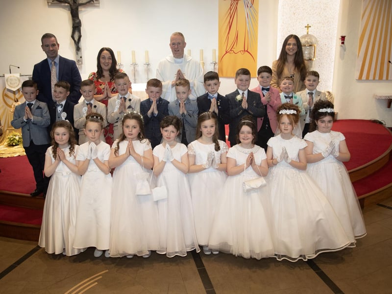 Pupils from Mrs. Vance's class at Greenhaw Primary School who received the Sacrament of First Holy Communion from Fr. Sean O'Donnell at St. Brigid's Church, Carnhill on Friday last. Included are Mr. Sean McLaughlin, Principal and Miss Coyle, teaching assistant. (Photo: Jim McCafferty Photography)