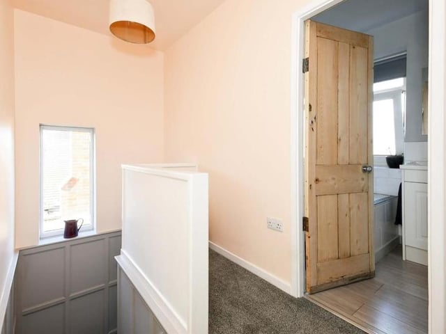 It's time to go upstairs, where we are are greeted by this landing, which leads to all three bedrooms. It has a fitted-carpet floor and also access to the loft.