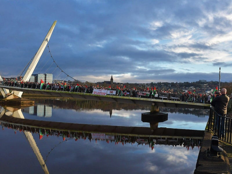 Hundreds of people gather on Derry’s Peace Bridge, on Sunday afternoon, in solidarity with Gaza and Palestinians. Photo: George Sweeney.