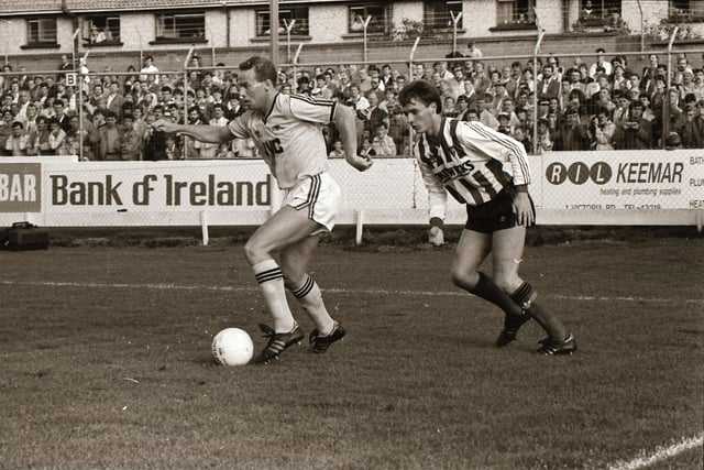 Paul Curran tracks Perry Groves.