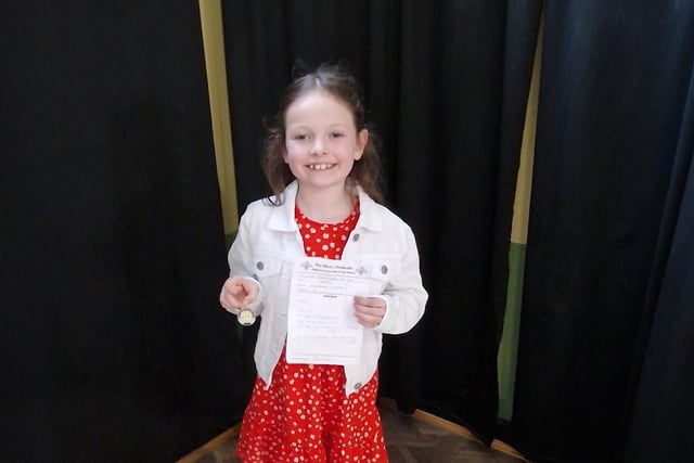 Aoibhín Logan, age eight, who was awarded first place in the English song. Aoibhín is a member of Hannigan singing school