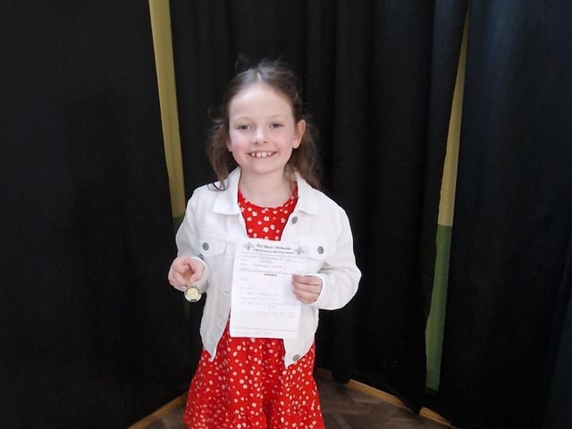Aoibhín Logan, age eight, who was awarded first place in the English song. Aoibhín is a member of Hannigan singing school