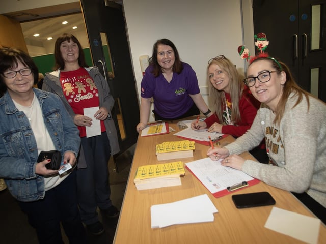 Old Library Trust staff in full festive spirit at Wednesday night's Christmas Bingo in Creggan. (Photos: Jim McCafferty Photography) : .