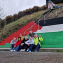 Derry IPSC activists pictured after they painted the red, black, white and green colours of the flag of Palestine on steps beneath the Foyle Bridge.