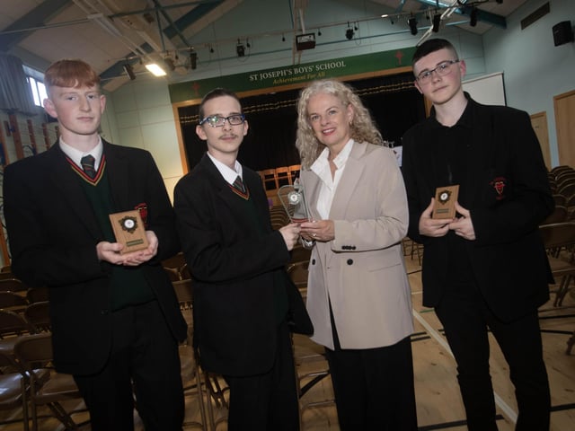 Mrs. Fiona Harrigan-Stewart, Vice Principal, St. Joseph's Boys School pictured presenting awards to, from left Shane McKinney, Kaylum McBride and Adam McKinney at Thursday's Prizegiving.