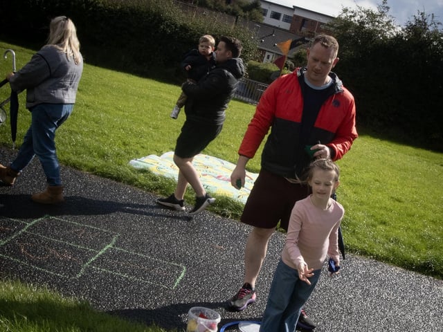 Dad and daughter Craig and Harriet McKinlay attempt to score some points in the Bean Bag Pot during Saturday's 'Waterside Together' - A Shared Spaces Mini Festival, held at Woodburn Urban Park. (Photos: Jim McCafferty Photography) : .