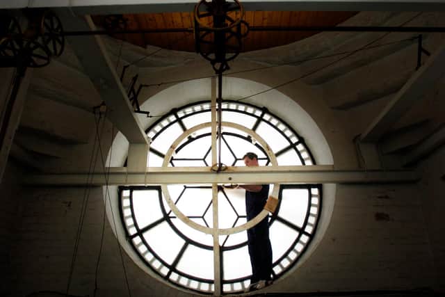 Craig Park, Ritchies Clockmakers, Edinburgh, performing essential maintenance on Derry's Guildhall Clock back in 2007. Photo: Stephen Latimer