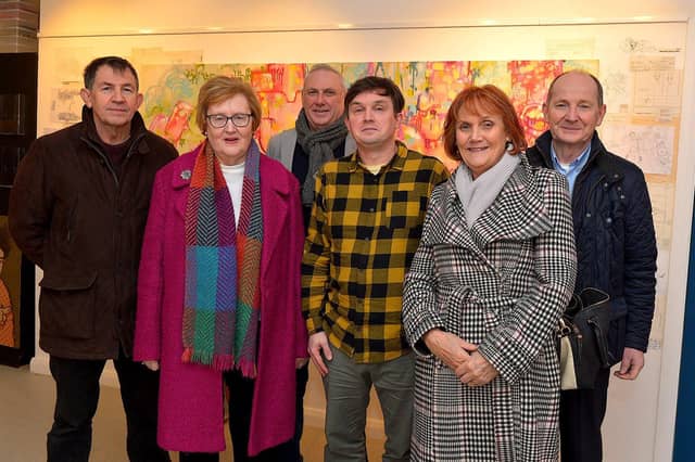 Street Artist and illustrator Elph One aka Brian McFeely pictured relatives Donncha McFeely, Kathleen Graffin, Michael McFeely, Brian McFeely, Paula McGinley and Joe McFeely at the launch of his ‘Doodles in Derry’ exhibition on Saturday in the UV Arts ‘The Urban Art Gallery’ in Bishop Street. Photo: George Sweeney. DER2301GS – 54