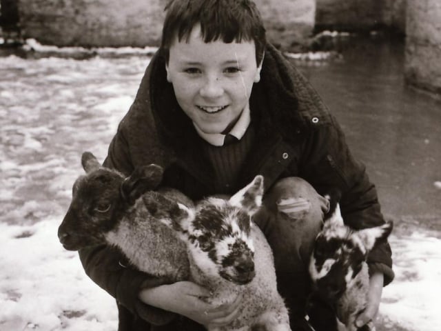 Jason Fair with newborn lambs in Fahan.